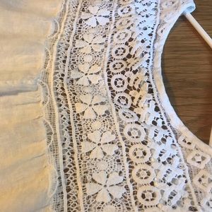 Sleeveless white linen dress